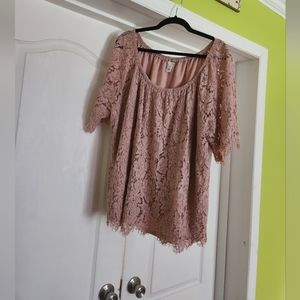 Mauve lace shirt. Has a liner in it. The lace sleeves are short with frayed lace